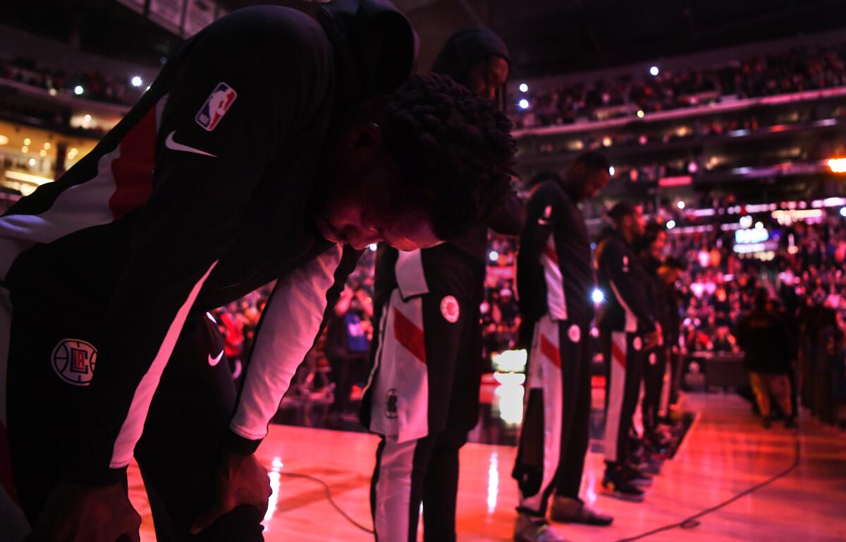 Patrick Beverly shows his emotions during a moment of silence before a game for Kobe Bryant on Jan. 30 at Staples Center.