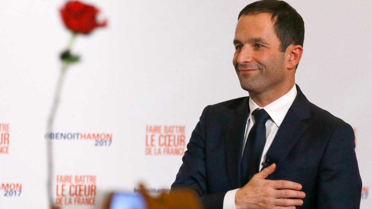 Benoit Hamon greets supporters after winning the Socialist Party presidential nomination in Paris on Sunday.