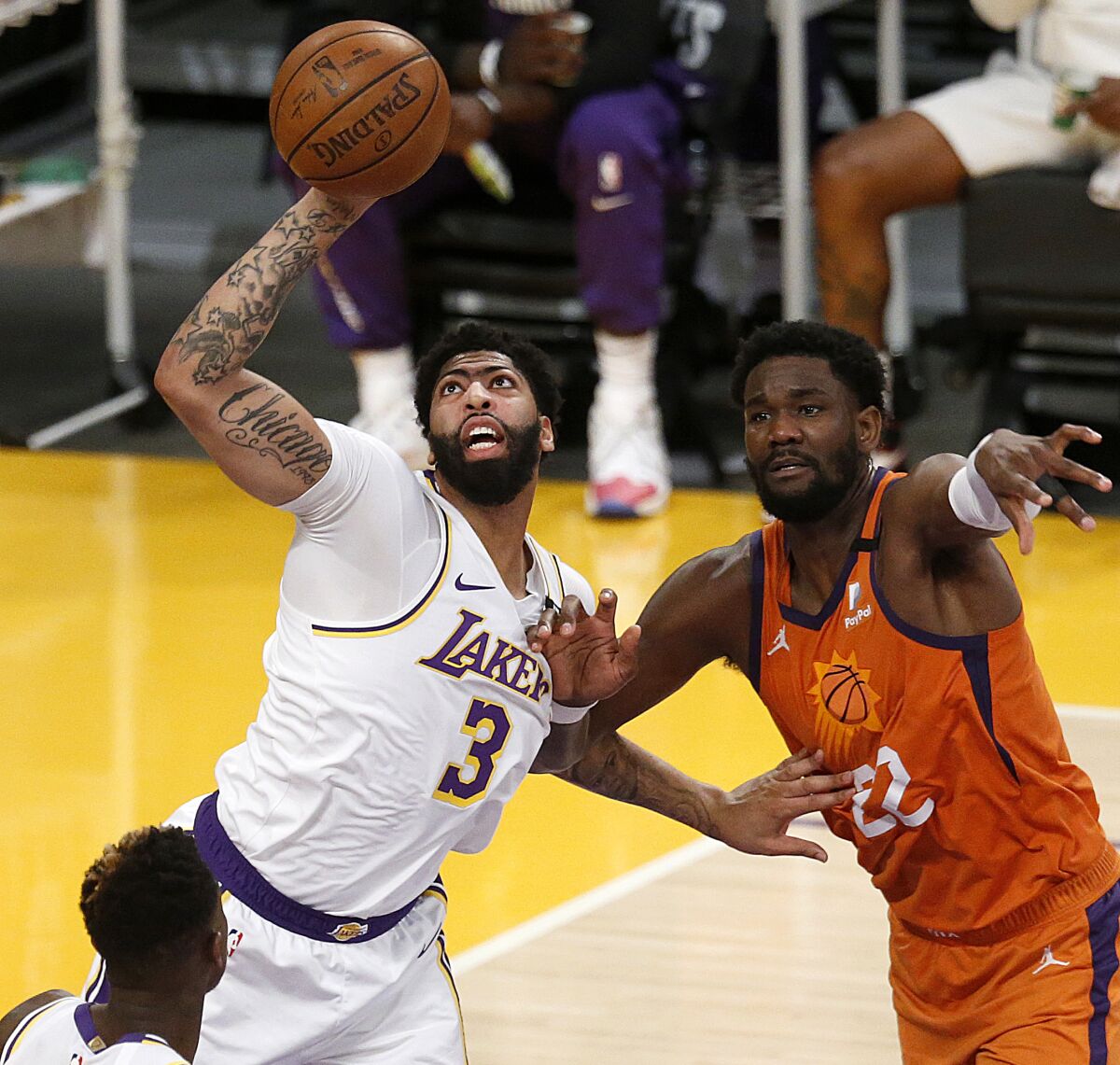 Lakers forward Anthony Davis intercepts a pass intended for Suns center Deandre Ayton during Game 4.
