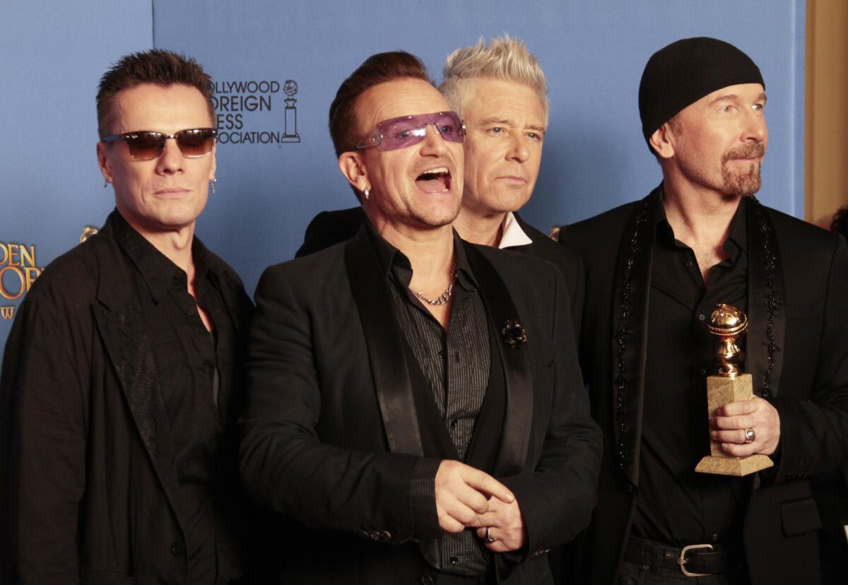 U2 at the Golden Globe Awards. The band's free iTunes release of its new album won't impact the Billboard 200 album charts.