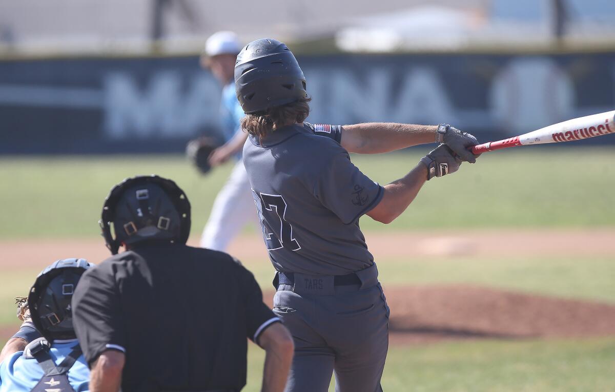 Newport Harbor High's Jack Bibb hits a two-run home run over the right-field fence in a Wave League game at Marina on Tuesday.