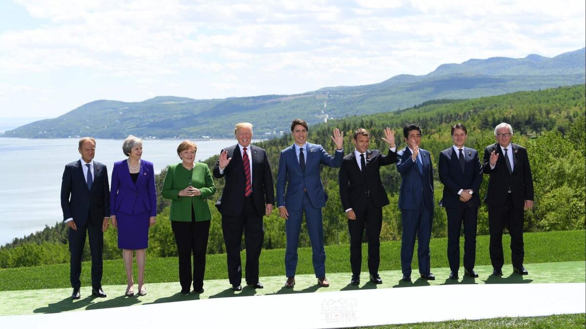 The leaders of the Group of 7 major economic powers, along with the heads of the European Council and the European Commission, pose for a traditional "family photo" during their summit in La Malbaie, Quebec, Canada, on Friday.