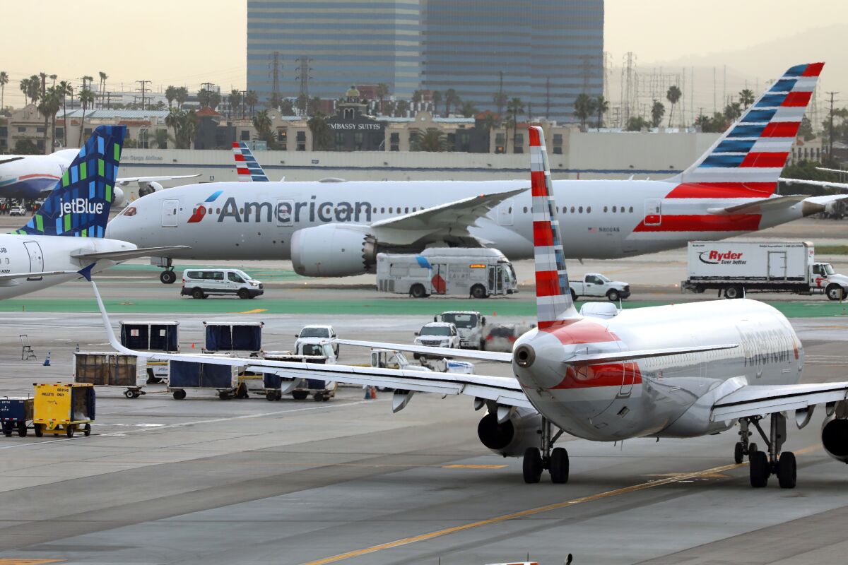 Planes prepare to take off at Los Angeles International Airport
