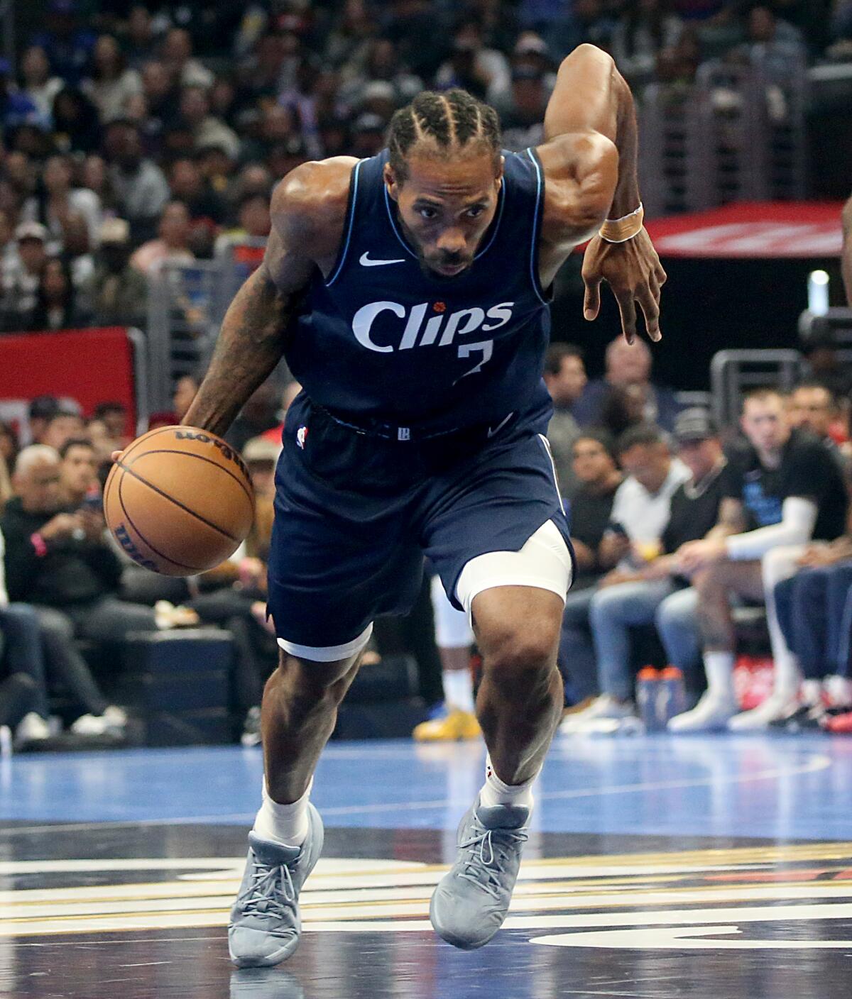 Clippers foward Kawhi Leonard heads up the court during a win over Houston at Crypto.com Arena on Nov. 17.