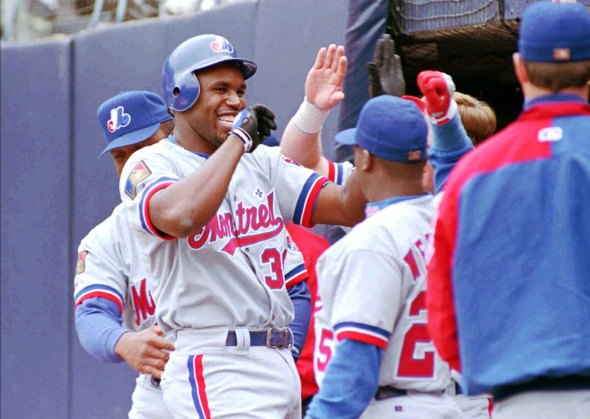 Cliff Floyd celebrates a home run for the Expos in 1994.