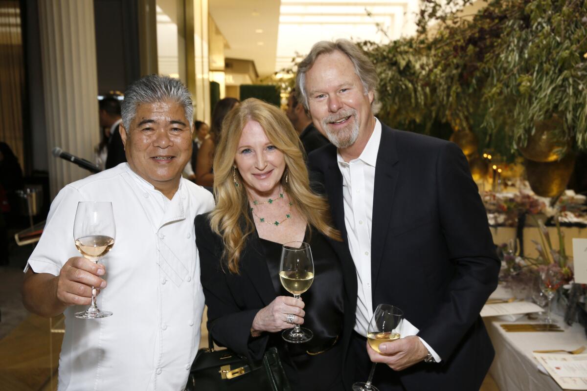 Restaurateur James Hamamori with Jennifer and Anton Segerstrom at Careers Through Culinary Arts Dinner at South Coast Plaza.