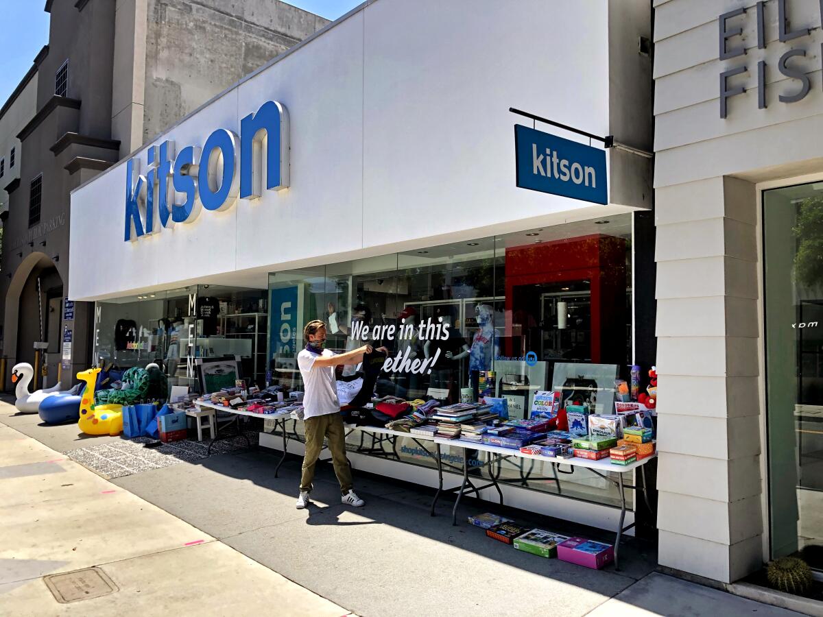 The Kitson store on Robertson with employee Tom Ernst out front