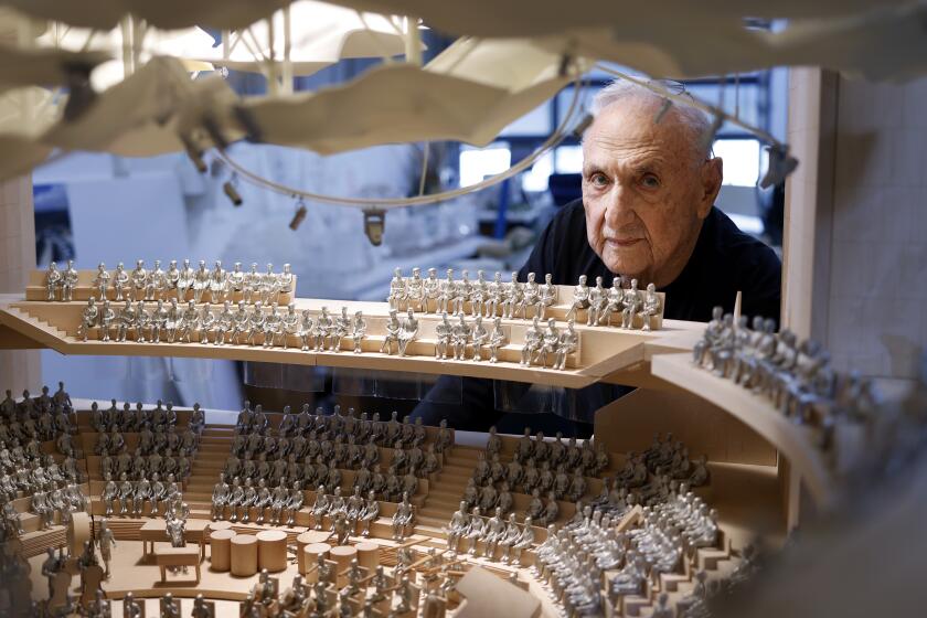 LOS ANGELES-CA-JANUARY 31, 2024: Architect Frank Gehry is photographed with a model of his design for an addition for Colburn School, a private performing arts school in downtown Los Angeles, which will make Bunker Hill the only place with three Gehry-designed buildings in close proximity, on January 31, 2024. (Christina House / Los Angeles Times)