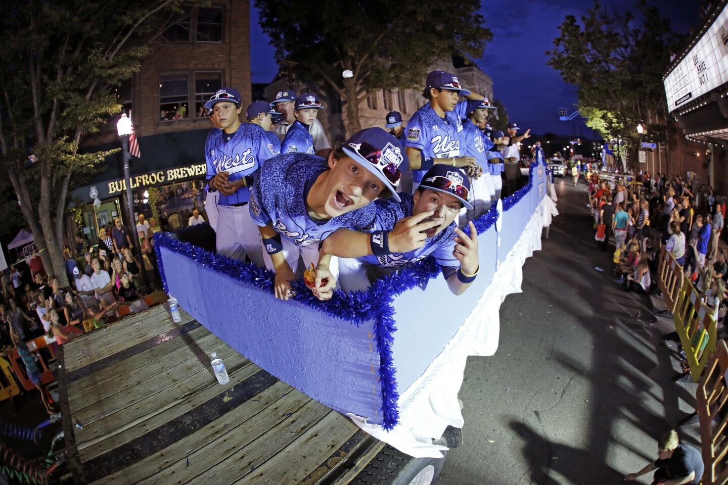 The Sweetwater Valley team rides in the Little League Grand Slam Parade in downtown Williamsport, Pa., Wednesday, Aug. 19, 2015.
