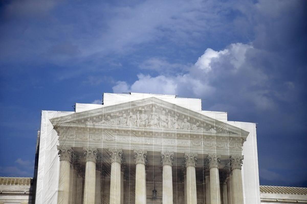 The U.S. Supreme Court, shown under scaffolding in August, is continuing operations despite the federal government shutdown.