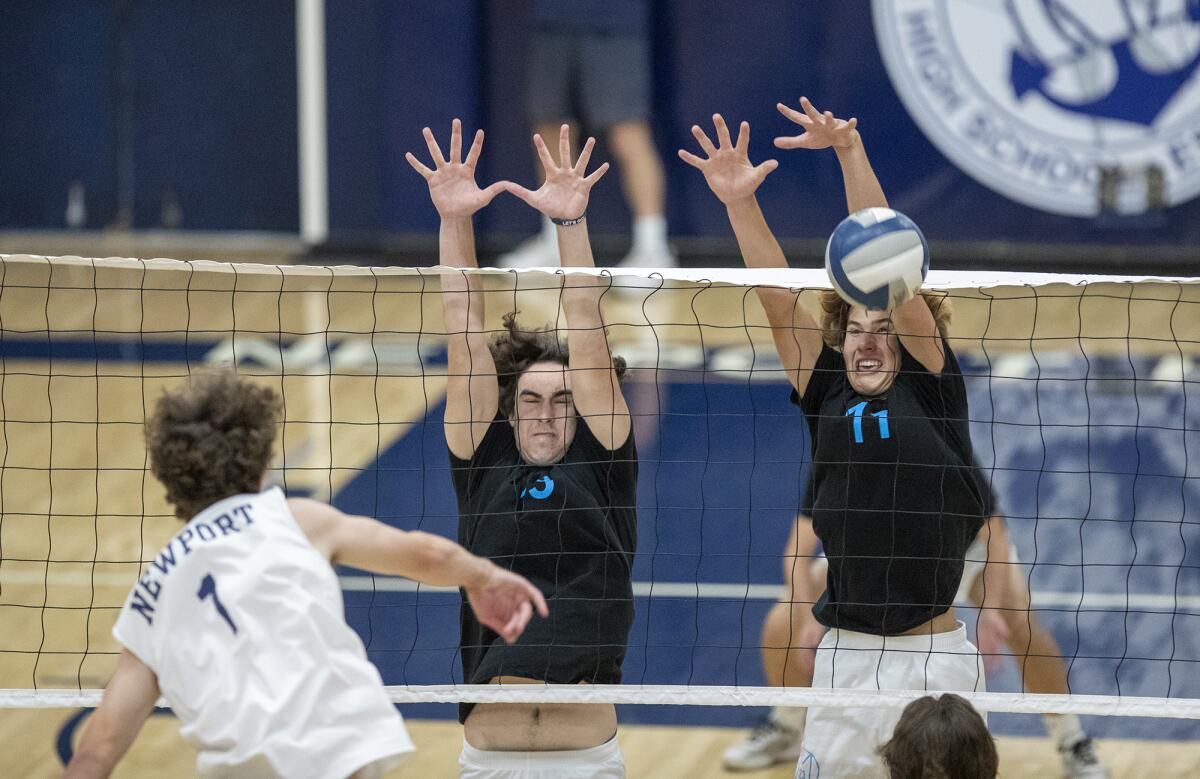 Corona del Mar's Buddy Cohen, left, and Sterling Foley attempt to block a shot from Newport Harbor's Brendan Read.