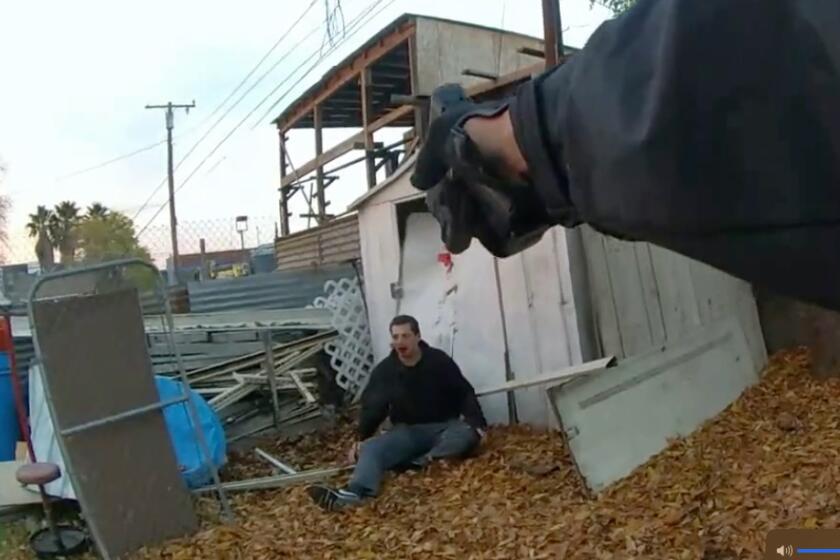 San Bernardino, California-According to the claim filed by Robert Brown's family, San Bernardino Police officer Jackson Tubbs tried to pull Brown over on Dec. 27 for a vehicle code infraction. In the video Robert Brown can be seen running past the gate of a home into a backyard, then jumping over fence, using both hands to pull himself over. "As such it was evident he was not holding any gun," the claim reads. (Courtesy of the Brown Family)