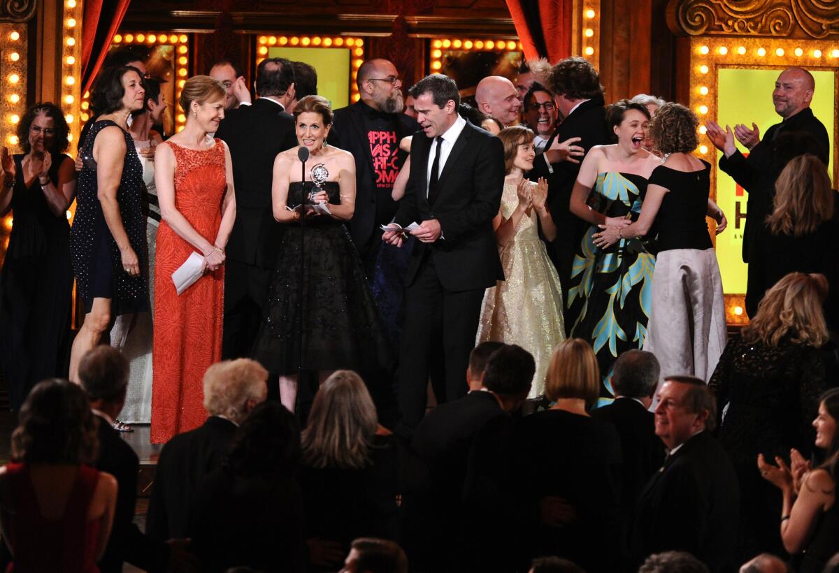 Kristin Caskey, center, along with cast and crew accepts the award for best musical for "Fun Home" during the 69th annual Tony Awards at New York's Radio City Music Hall on June 7, 2015.