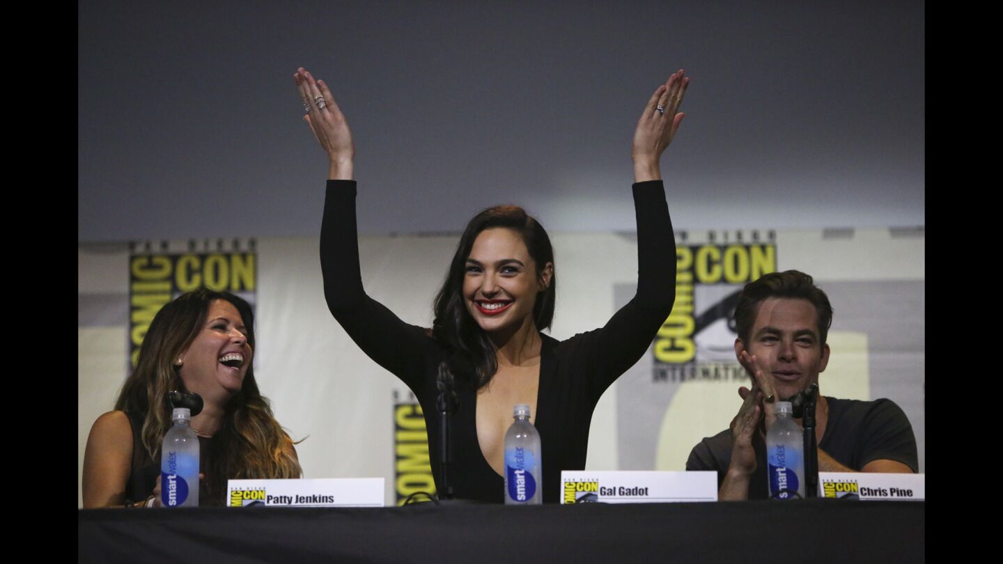 Actor Gal Gadot recognizes the crowd after the trailer for "Wonder Woman" is revealed during the third day of Comic-Con.