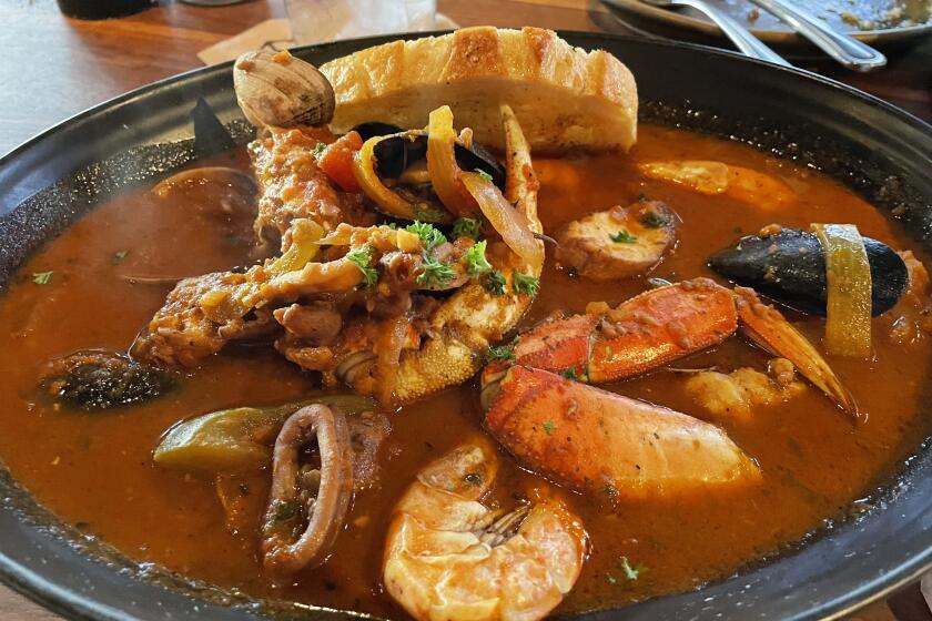 King’s Fish House’s cioppino is filled with seafood including Dungeness crab and jumbo shrimp.