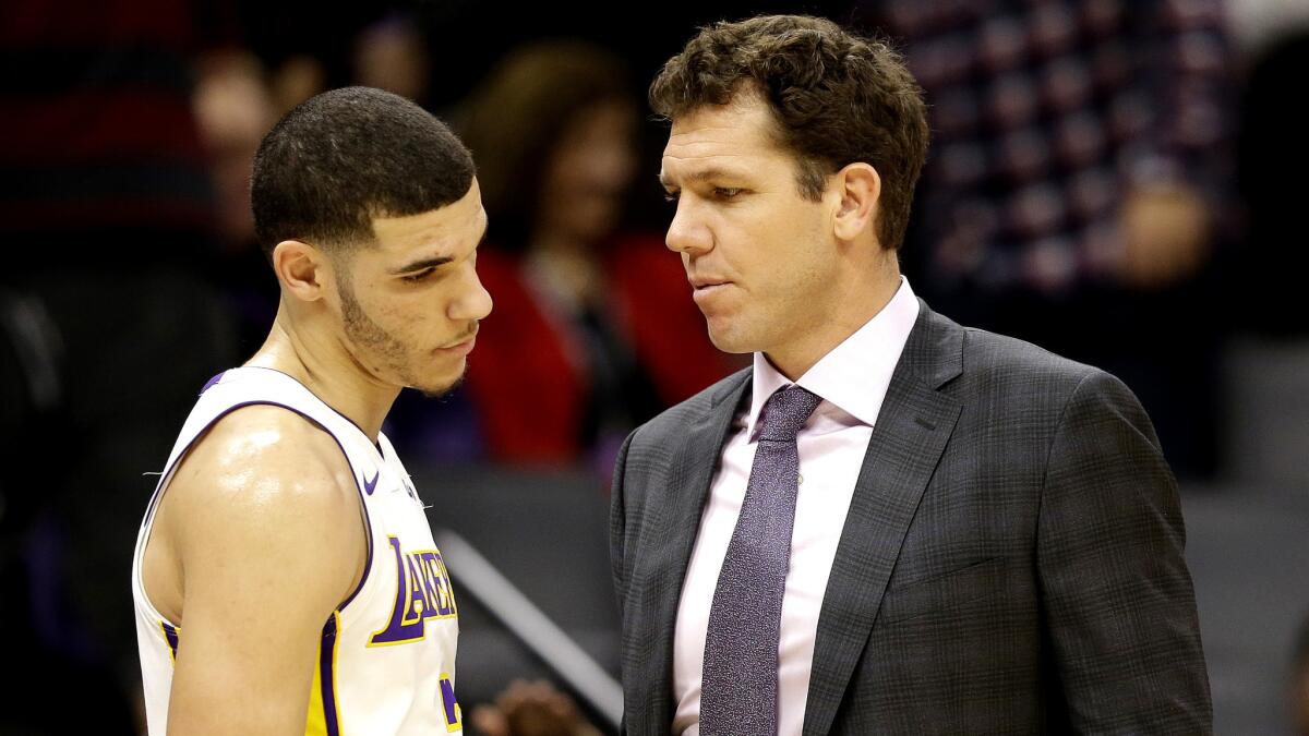 Lakers coach Luke Walton talks to guard Lonzo Ball during a break in the action in the second half Wednesday night.