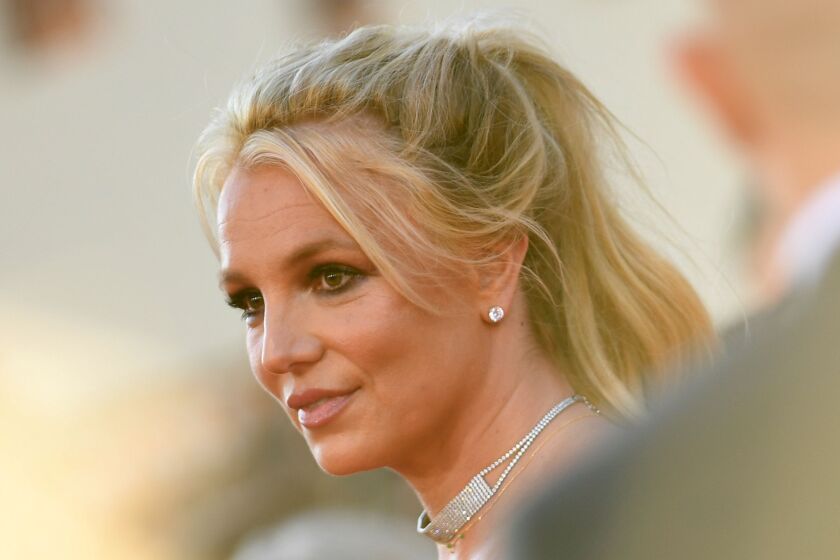 Britney Spears in the middle of a crowd at a Hollywood event