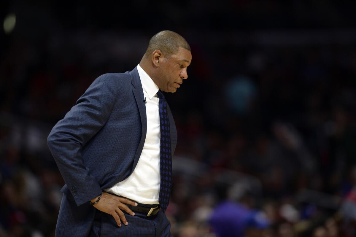 Clippers Coach Doc Rivers looks down during the first quarter of a game March 15 against the Houston Rockets.