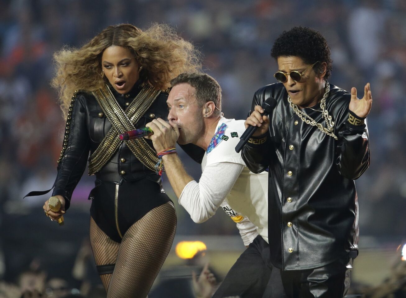 Beyonce, Coldplay singer Chris Martin, center, and Bruno Mars perform during halftime of Super Bowl 50.