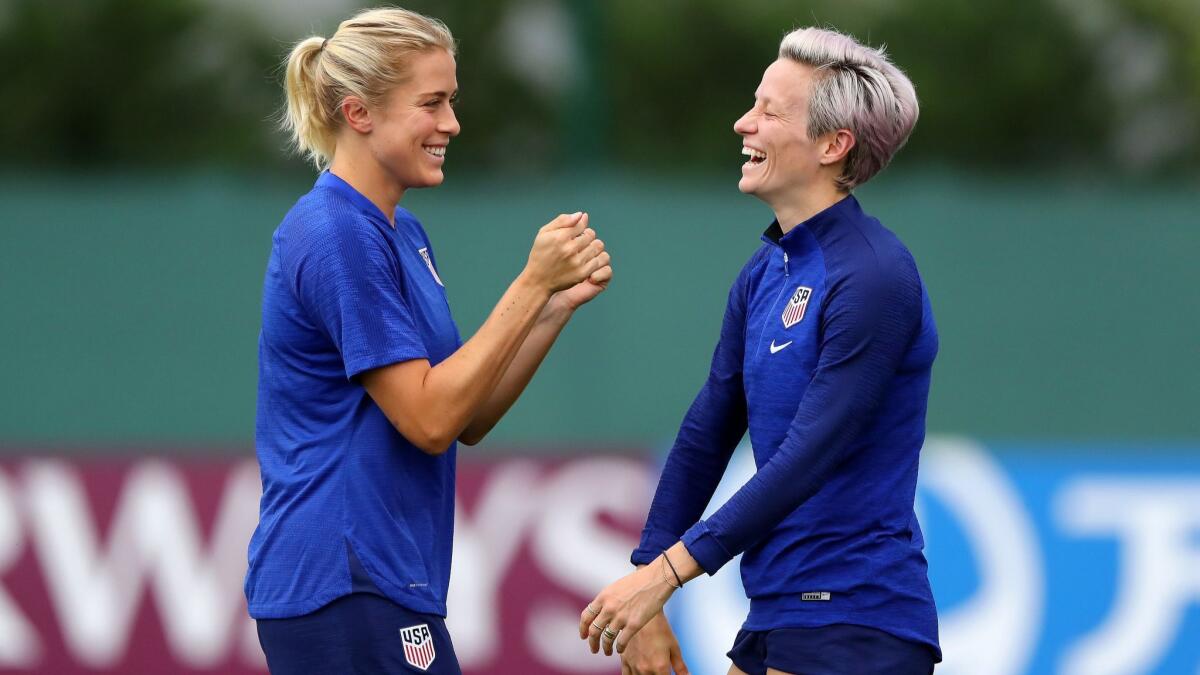 U.S. teammates Abby Dahlkemper, left, and Megan Rapinoe were loose while training July 1 in Lyon, France. The U.S. takes on England in a Women's World Cup semifinal match Tuesday at noon.