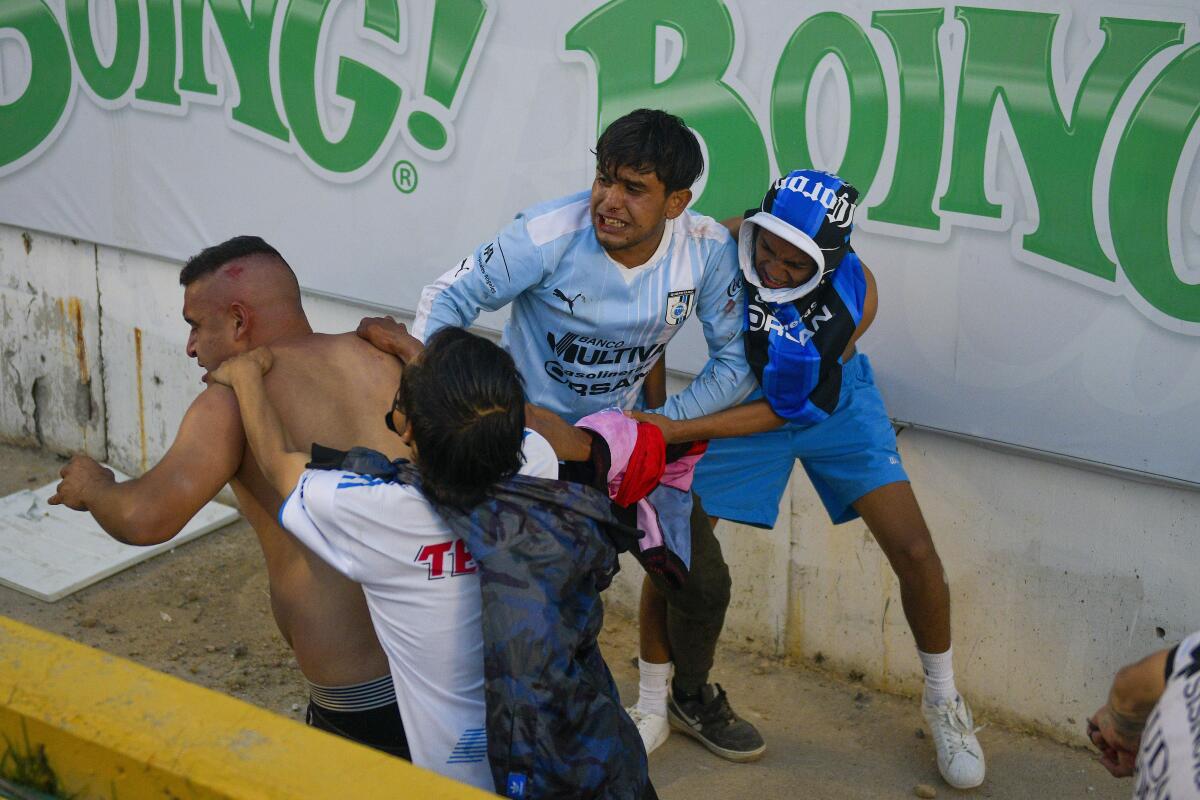 Mexican soccer game brawl: At least 26 injured as fights break out at Liga MX game between Querétaro and Atlas fans