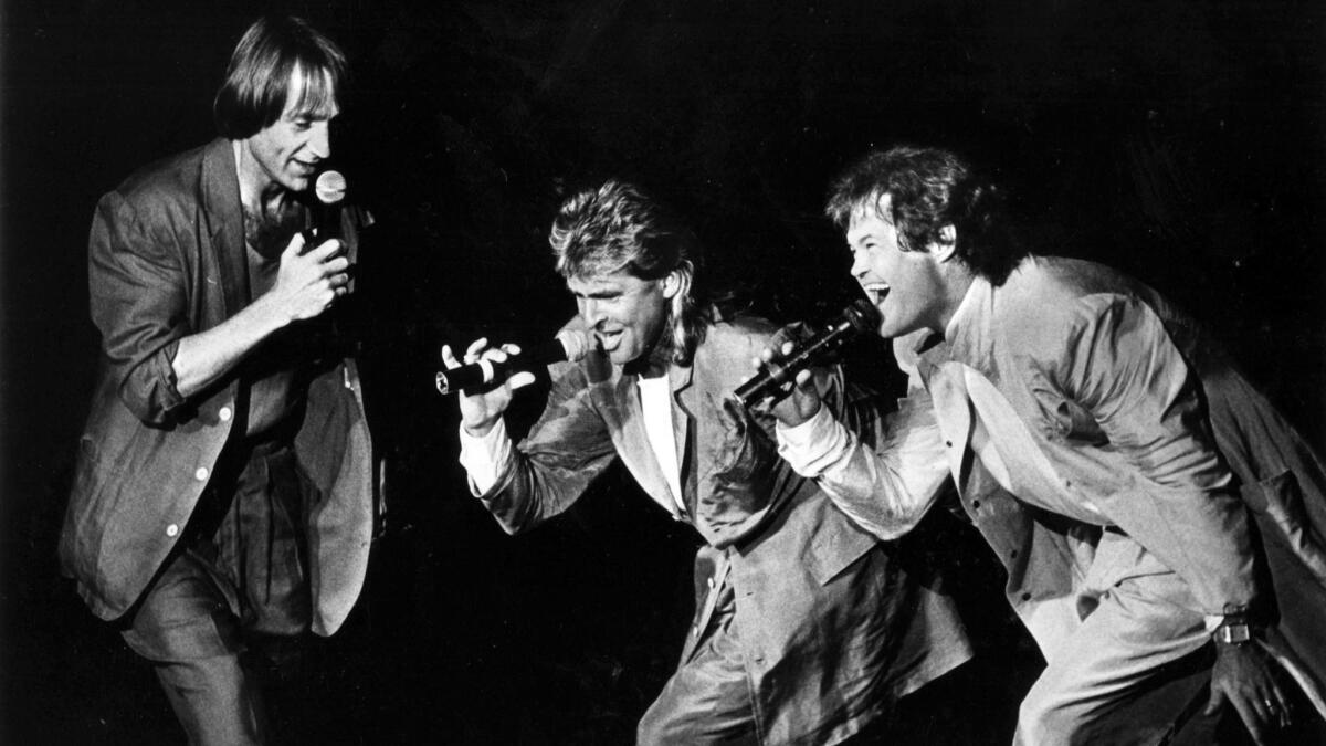 The Monkees — Peter Tork, left, Davy Jones and Micky Dolenz (performing without Michael Nesmith) — on the group's 20th-anniversary tour in 1986.