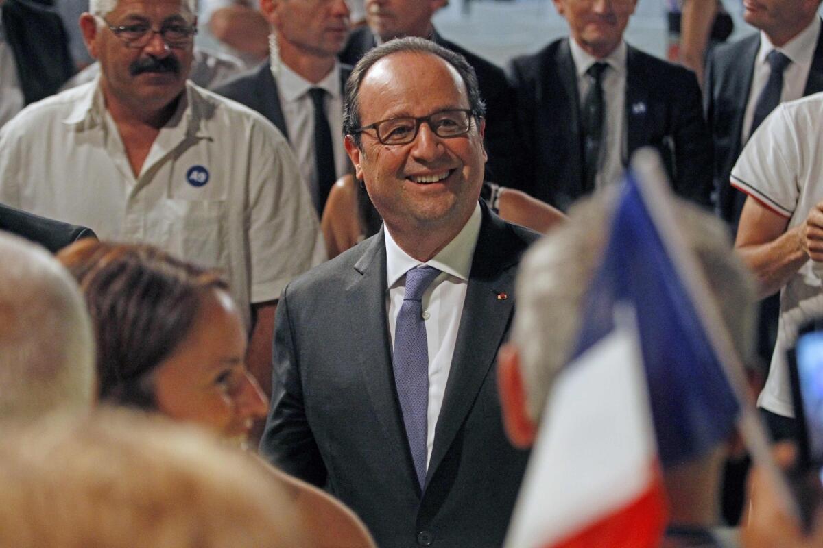 French President Francois Hollande meets the public in Rivesaltes in southern France on July 28.