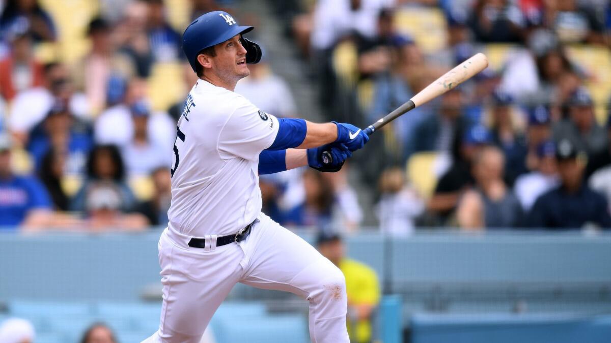 Dodgers infielder David Freese hits a solo home run against the Philadelphia Phillies on June 2. Freese is back on the active roster heading into Friday's game against the Boston Red Sox.