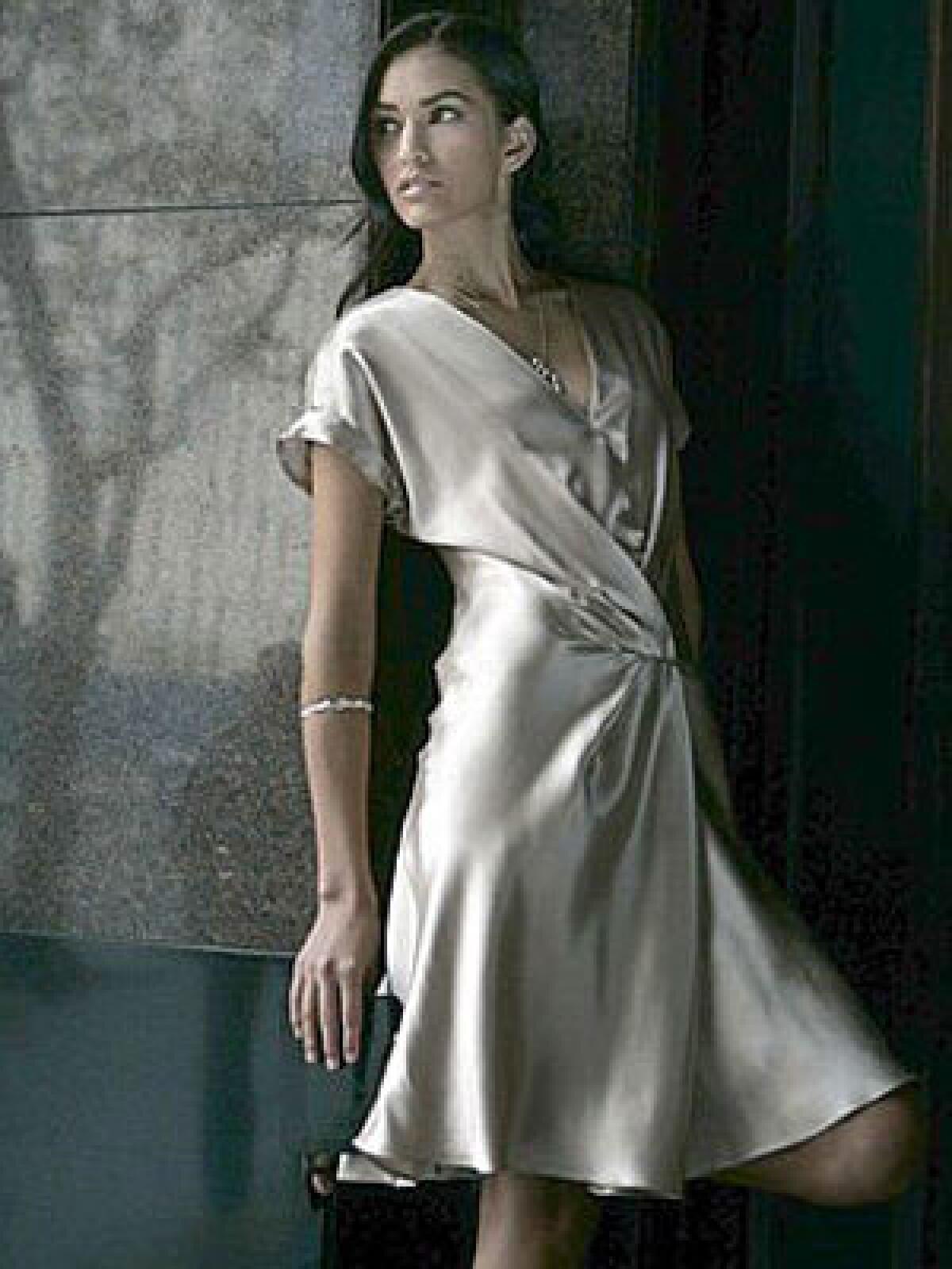 SILVERY SMOOTH: Banana Republic Heritage runway pleat dress, $130 at www.bananarepublic.com; Alex Woo Sweni chunky horn bangle in sterling silver, $448, and large horn pendant in sterling silver, $318, at www.alexwoo.com.