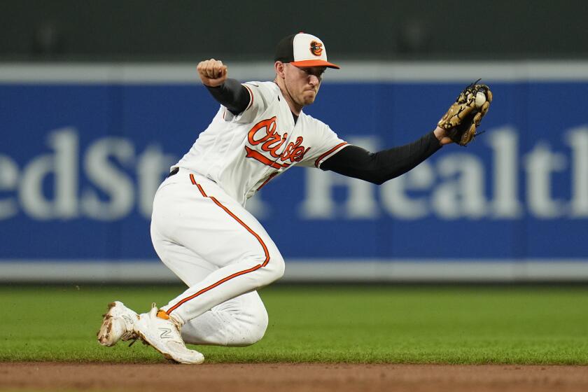 Baltimore Orioles second baseman Jordan Westburg makes a stop on a groundball hit by Boston Red Sox's Wilyer Abreu before throwing him out at first base during the second inning of a baseball game, Thursday, Sept. 28, 2023, in Baltimore. (AP Photo/Julio Cortez)