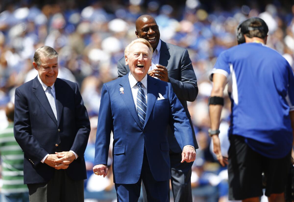 Dodgers announcer Vin Scully is honored at home plate on his last opening day.