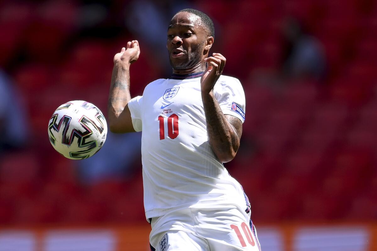 England's Raheem Sterling eyes the ball during the Euro 2020 soccer championship group D match between England and Croatia, at Wembley stadium, London, Sunday, June 13, 2021. (Laurence Griffiths, Pool via AP)