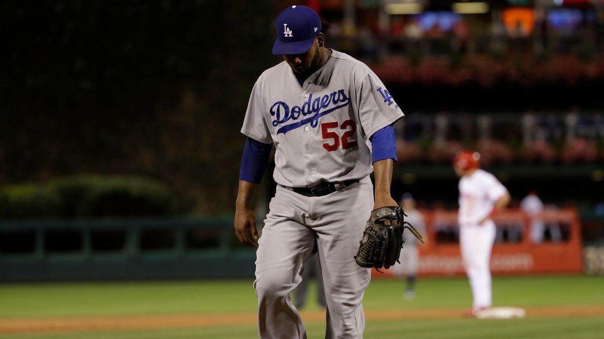 Dodgers reliver Pedro Baez walks off the mound during a against the Philadelphia Phillies on Tuesday.