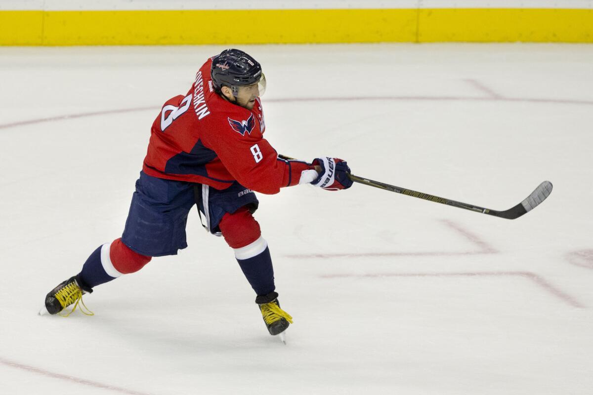 Capitals left wing Alex Ovechkin (8) follows through as he scores his 500th career goal during the second period of a game against the Senators.