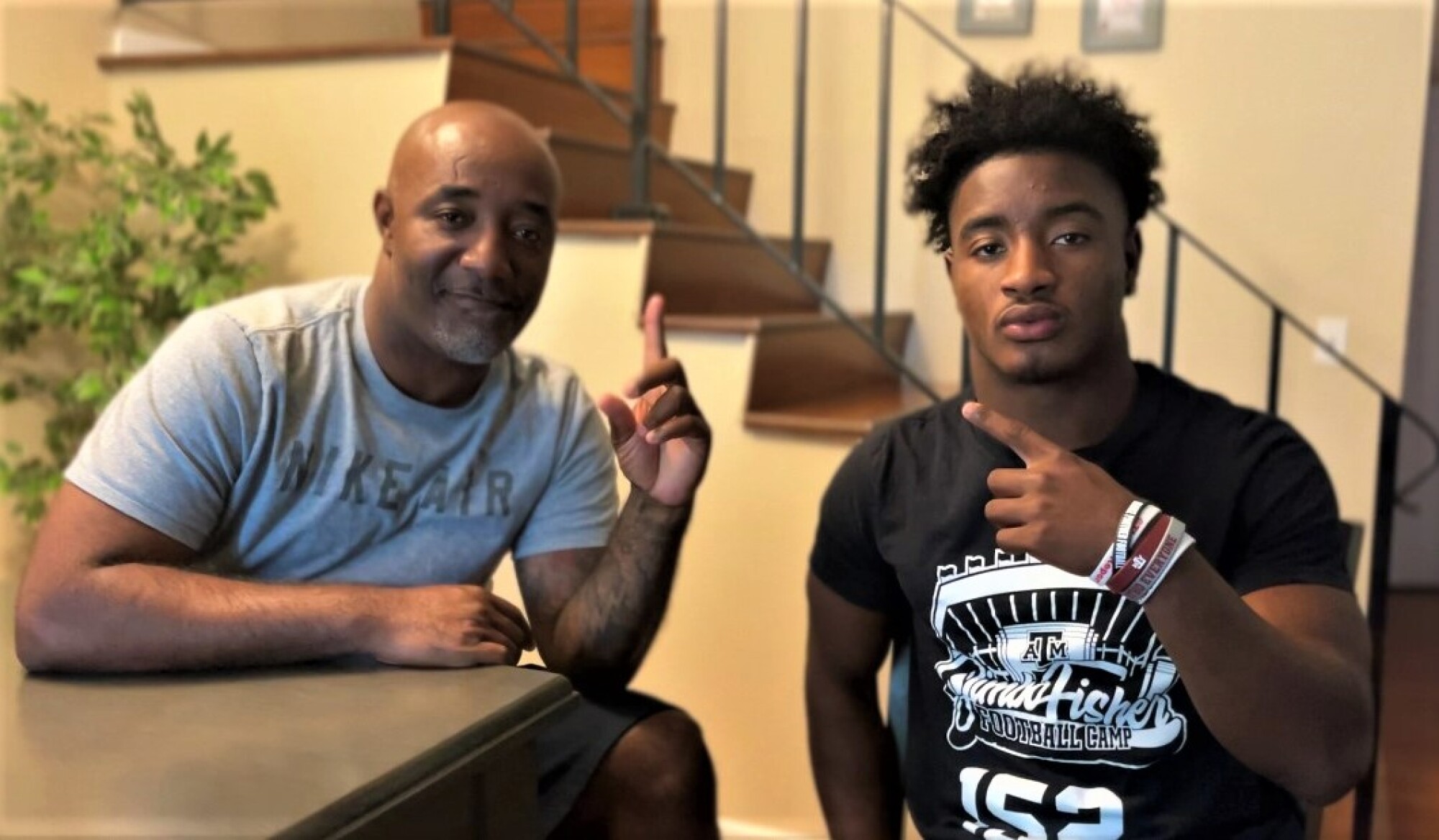 Timothy and Kobe Boykin signal No. 1 because they want Kobe to be the one who fulfills his football dreams.