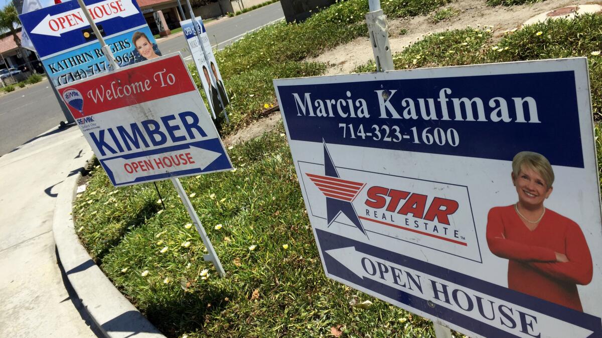 Open house signs in Huntington Beach on May 21.