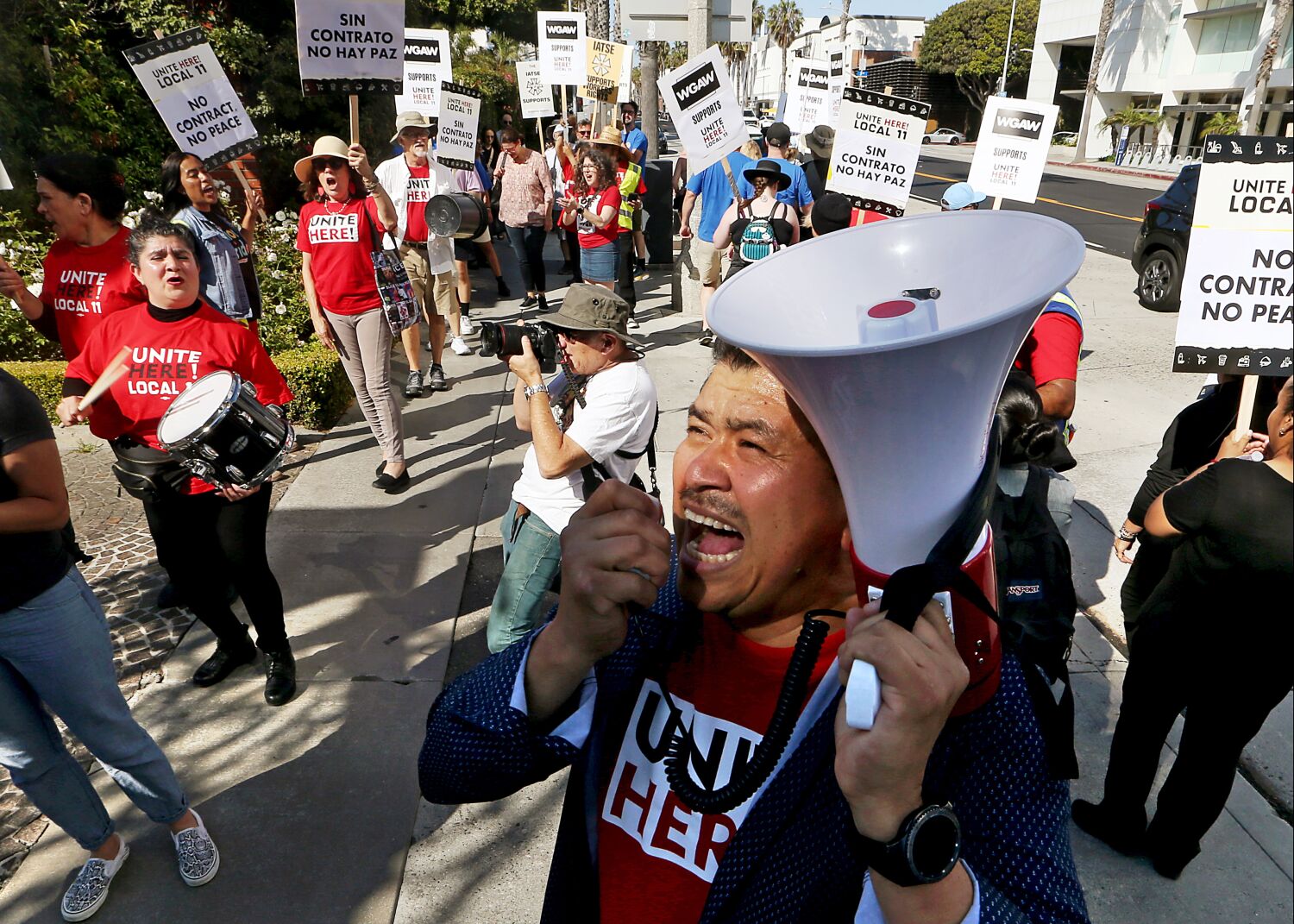 Column: On the picket line, a telling alliance between hotel workers and screenwriters