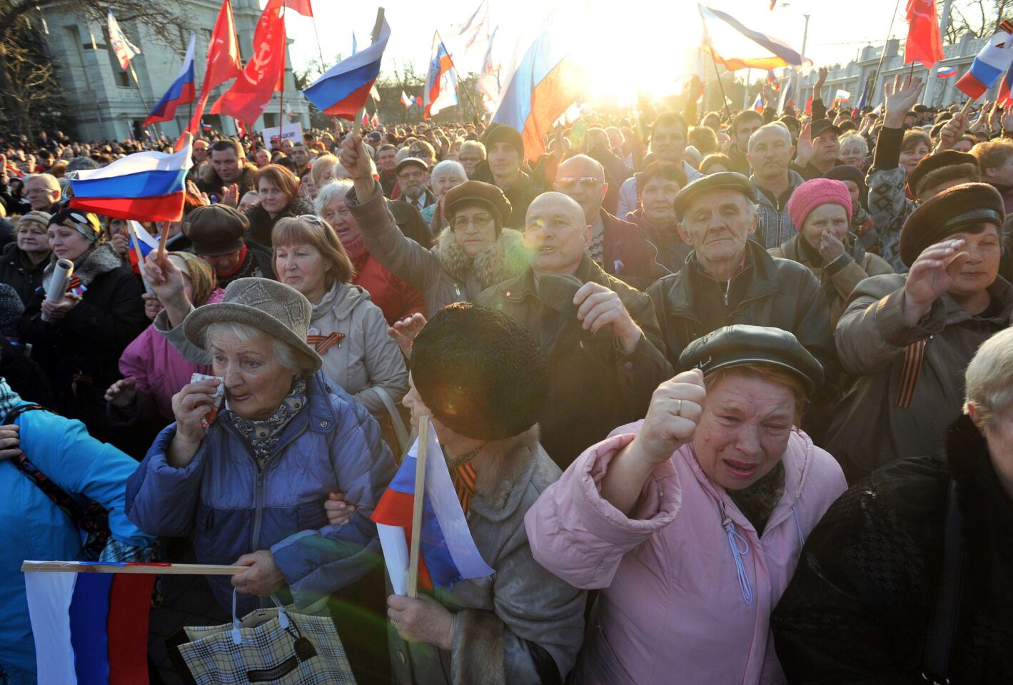 Pro-Russian activists holding Russian flags take part in a rally in the western Crimean city of Yevpatoria, Ukraine.
