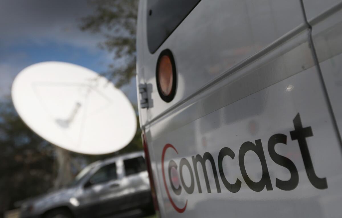 A Comcast truck is parked at one of the company's centers on Feb. 13, 2014, in Pompano Beach, Fla. Today Comcast announced a $45-billion offer for Time Warner Cable.