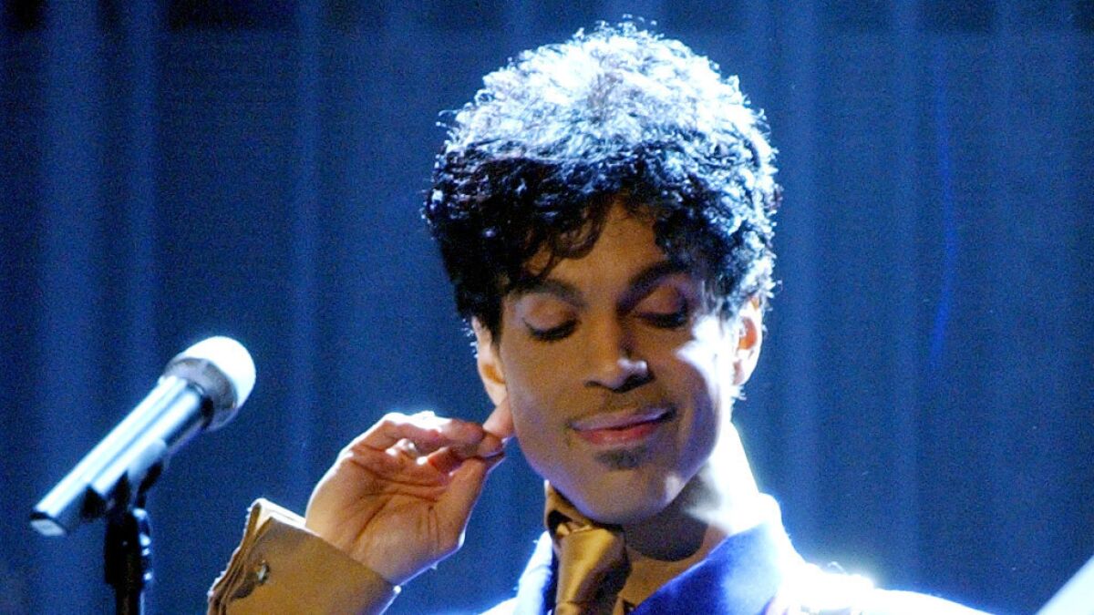 Prince performs "Purple Rain" during the 46th Grammy Awards at the Staples Center on Feb. 8, 2004.
