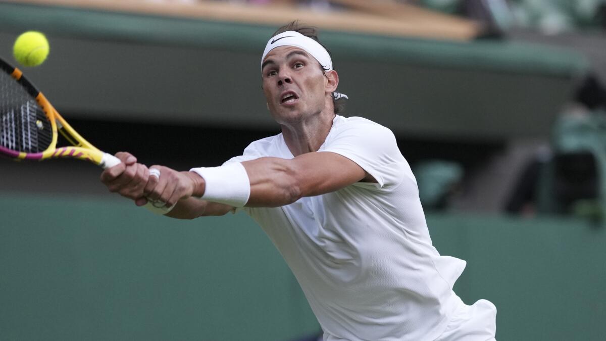 Spain's Rafael Nadal returns the ball to the Netherland's Botic Van De Zandschulp at Wimbledon on Monday.