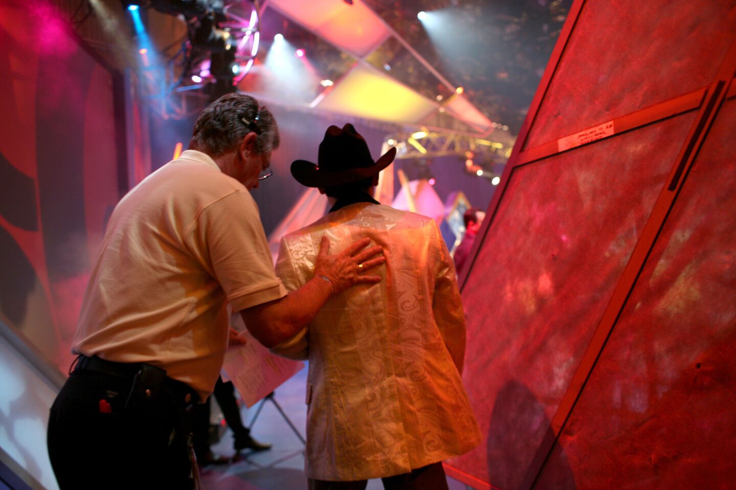 Mexican singer Ernesto Perez gets encouragement from a stage manager before performing. The live-music acts are one of the most popular features of "Sábado Gigante," and the spots are much coveted by recording artists because of the massive exposure the show receives around the Spanish-speaking world.
