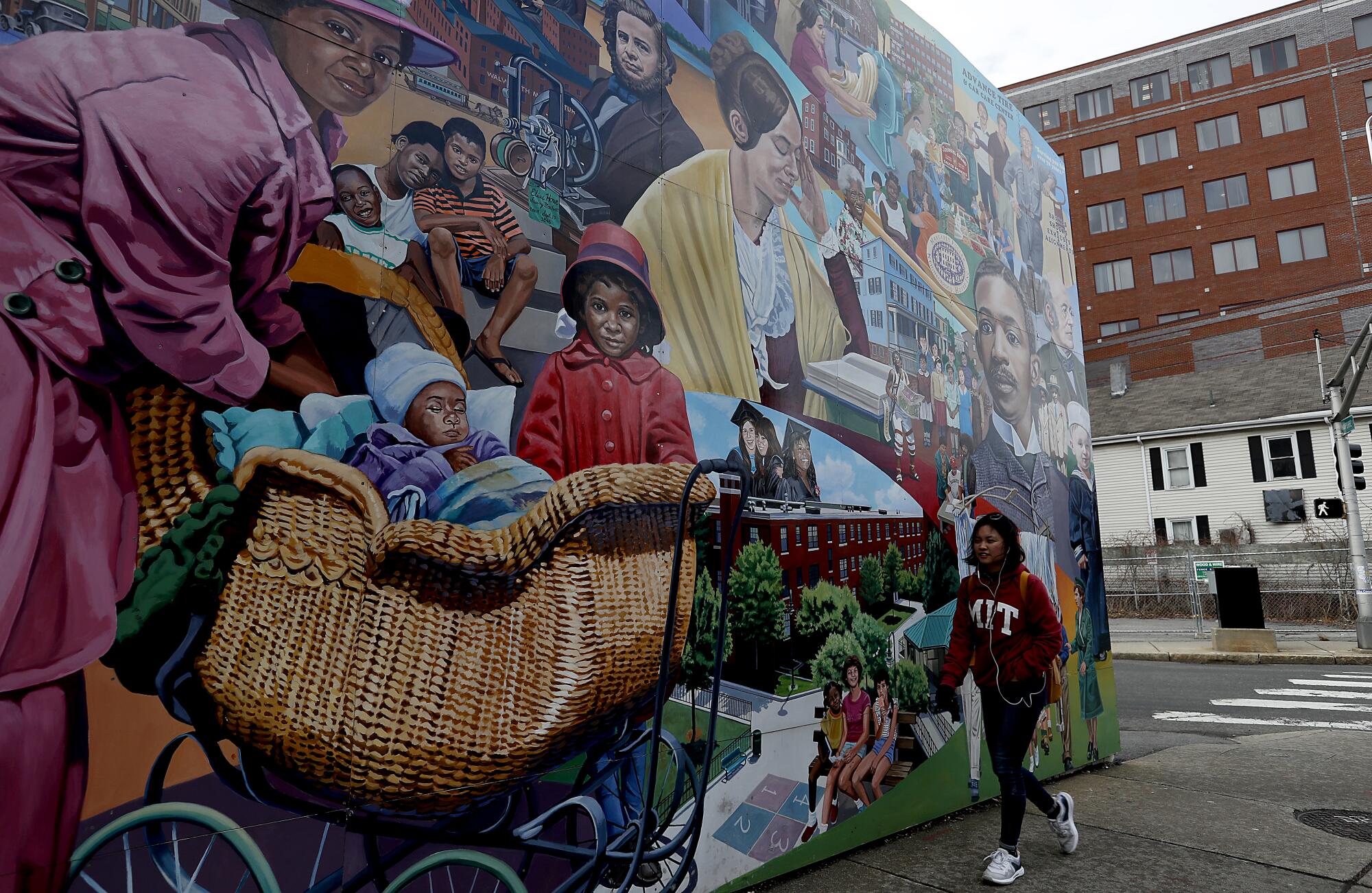 A mural depicts the history of the Port section of Cambridge, where construction fueled by high-tech startups in Kendall Square is changing the makeup of a historically black area.