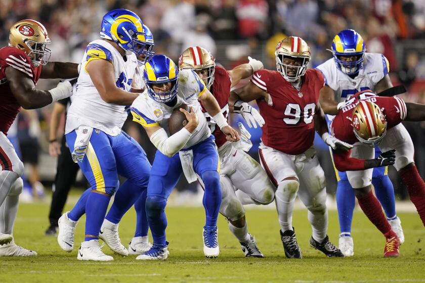 Los Angeles Rams quarterback Matthew Stafford scrambles during an NFL football game against the San Francisco 49ers in Santa Clara, Calif., Monday, Oct. 3, 2022. (AP Photo/Godofredo A. Vásquez)