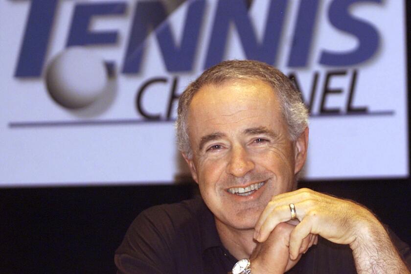 Frank Biondi, former CEO of Viacom, smiles as he takes questions during a news conference announcing a new cable network, The Tennis Channel, in 2001.