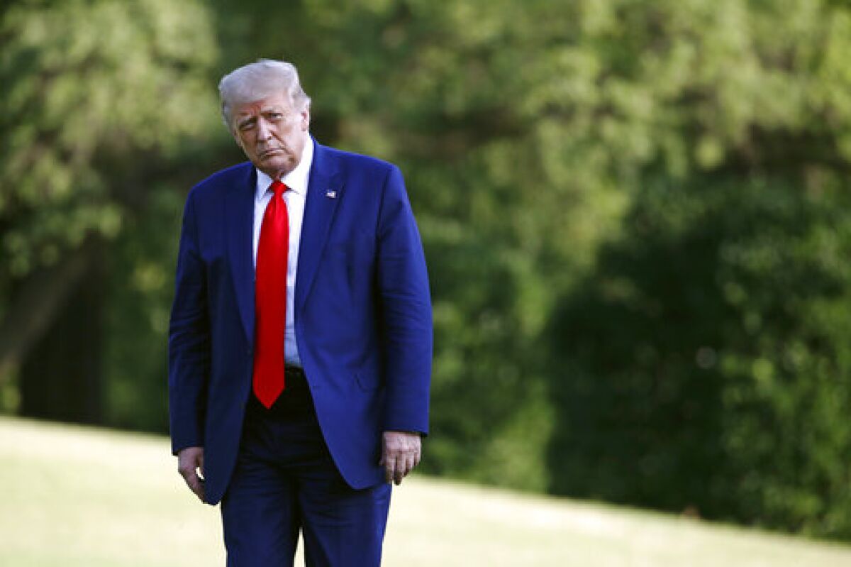 President Donald Trump walks on the South Lawn of the White House in Washington, Wednesday, July 15, 2020.
