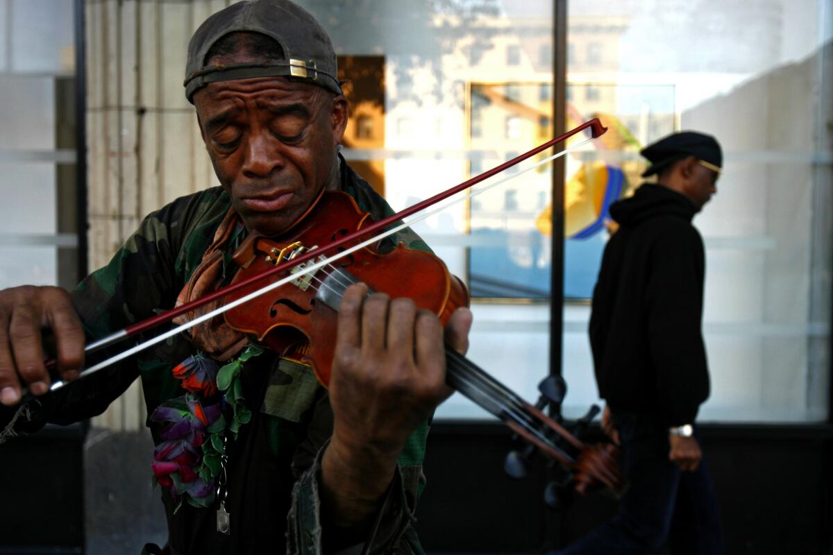 Nathaniel Ayers playing a violin