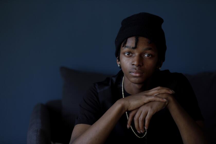 LOS ANGELES, CA December 12, 2018: Portrait of Dimitri Dunn, 19, in his Koreatown apartment December 12, 2018. He was born in prison and spent his entire life in foster care. (Francine Orr/ Los Angeles Times)