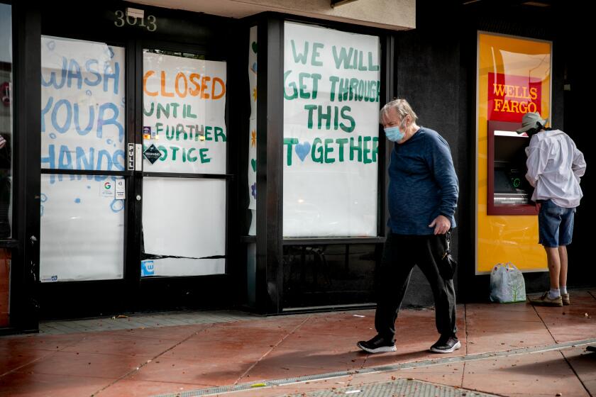 A boutique is shut down on University Avenue, immediately next to a Wells Fargo ATM on May 28, 2020 in San Diego, California.