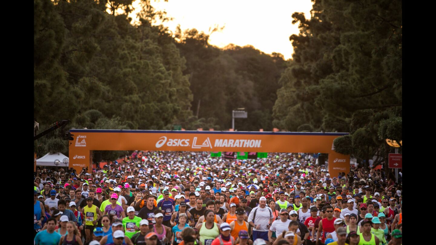 Runners make their way on the first mile at start of the 30th Los Angeles Marathon.